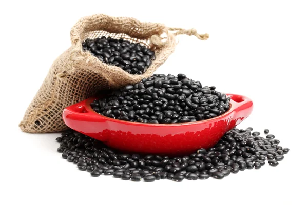 Black beans on red plate — Stock Photo, Image