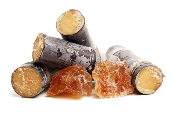 Dry sugar cane and pieces of sugar — Stock Photo, Image