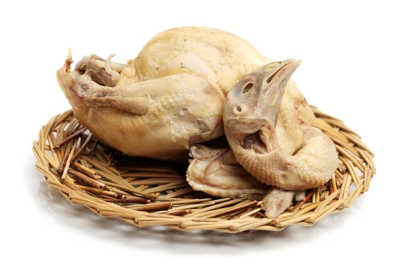 Raw chicken on straw plate — Stock Photo, Image