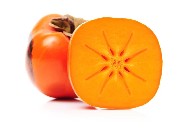 Plasterki i cały persimmons — Zdjęcie stockowe