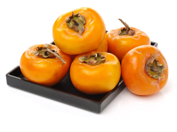 Frische ganze Persimmons — Stockfoto