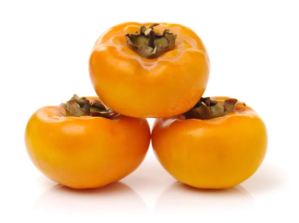 Persimmons inteiros frescos — Fotografia de Stock