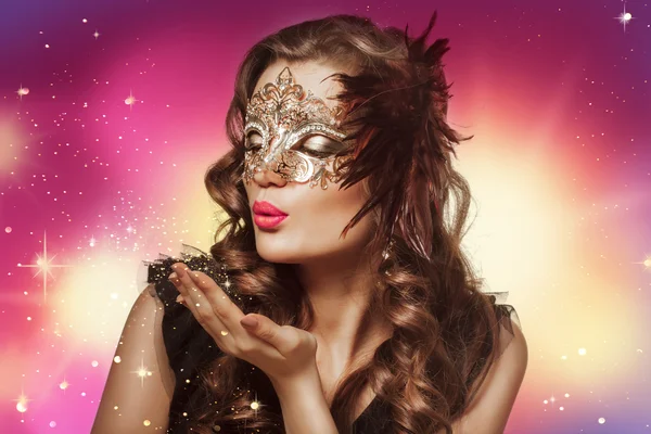 Beauty shoot of smart brunette woman in carnival mask over color Stock Picture