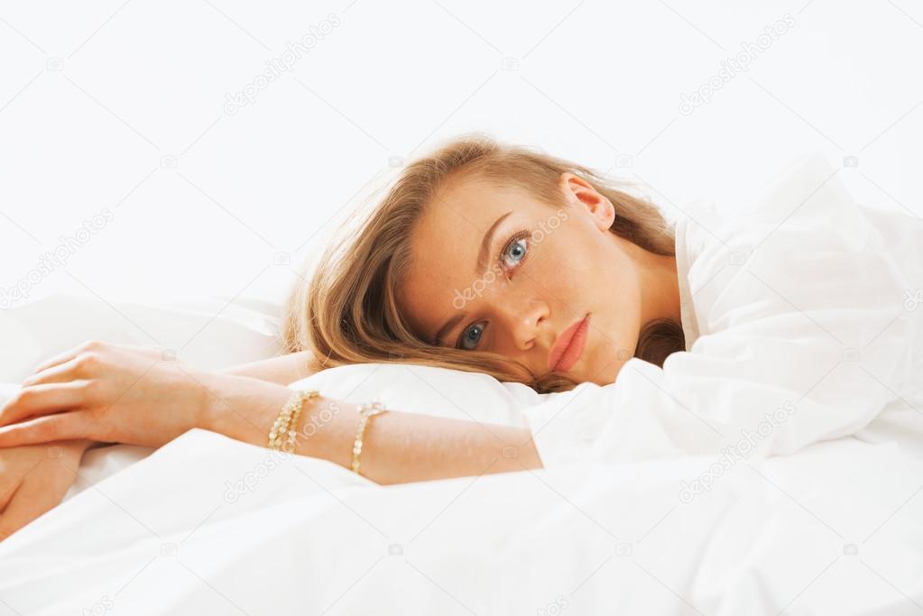 Portrait of young beautifulwoman waking up in the morning on the