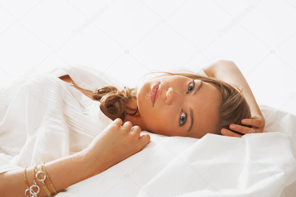 Portrait of young beautifulwoman waking up in the morning on the