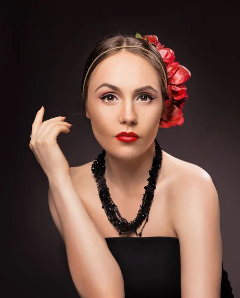 Portrait of glamorous brunette girl over dark background with bu — ストック写真