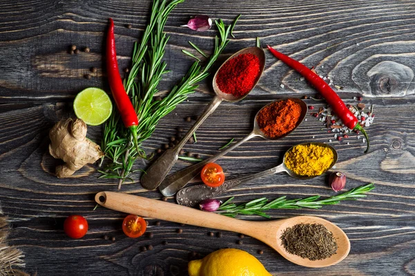 Spices over wooden background — Stock Photo, Image