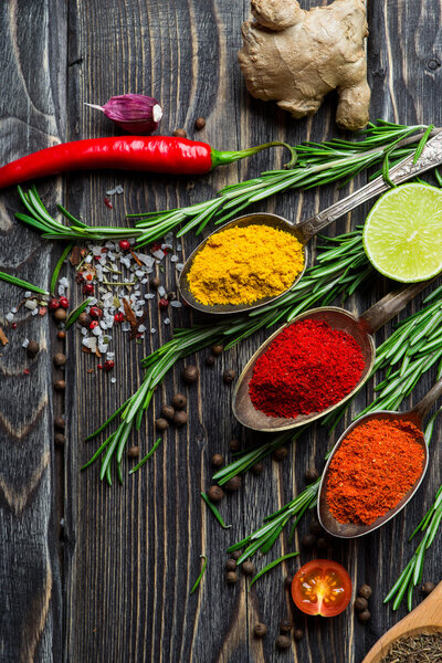 Spices over wooden background