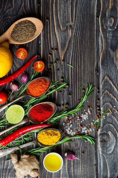 Spices over wooden background