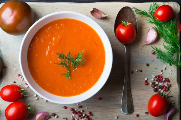 Tomato soup on a wooden table — Stock Image Tomato soup on a wooden table Stock Photo