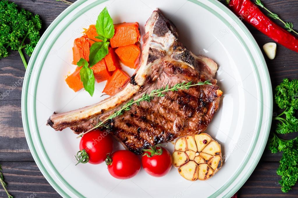 Steak with vegetable garnish