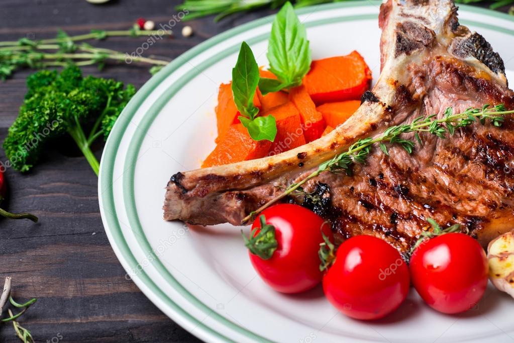 Steak with vegetable garnish