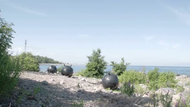 Three big sea mines found on the rocky shore of the sea FS700 Odyssey 7Q — Stock Video