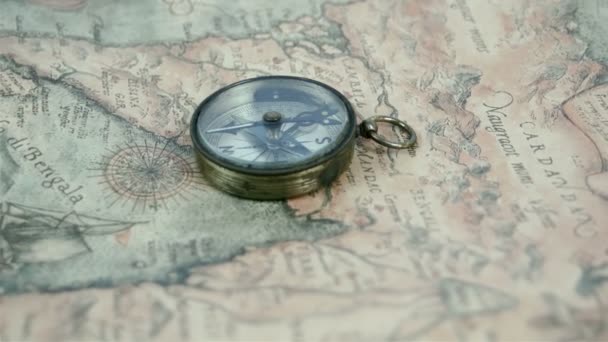 A compass in the middle of the map — Stock Video