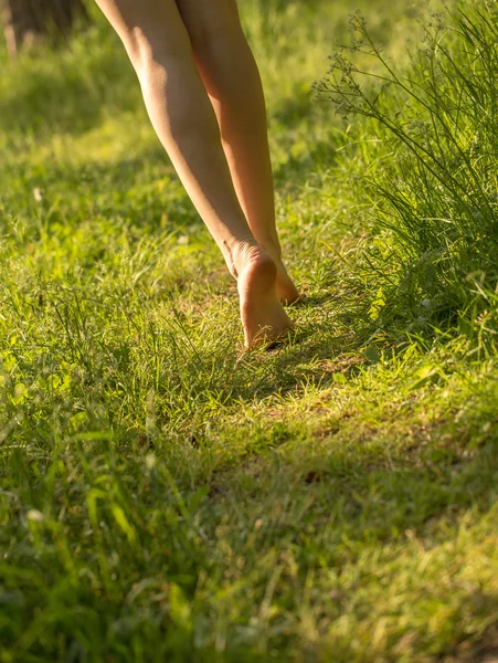 Female walking on lawn — Stock Photo, Image