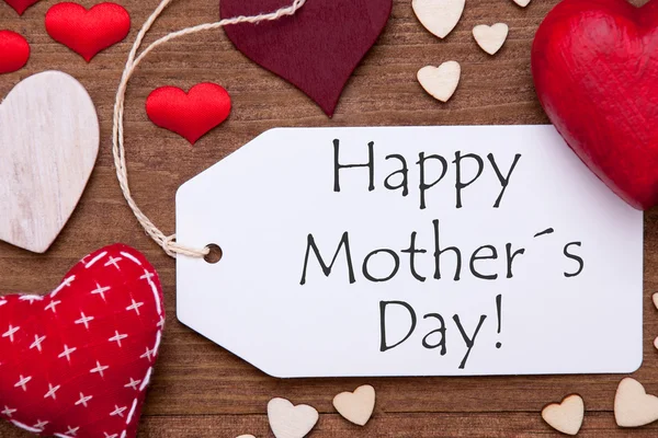 Um rótulo, corações vermelhos, dia feliz das mães, macro — Fotografia de Stock