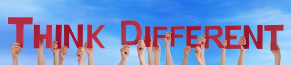 People Hands Holding Red Straight Word Think Different Blue Sky — Stockfoto