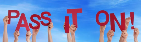 People Hands Holding Red Word Pass It On Blue Sky — Stok Foto