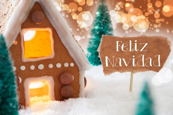 Gingerbread House, Bronze fundo, Feliz Navidad significa Feliz Natal — Fotografia de Stock