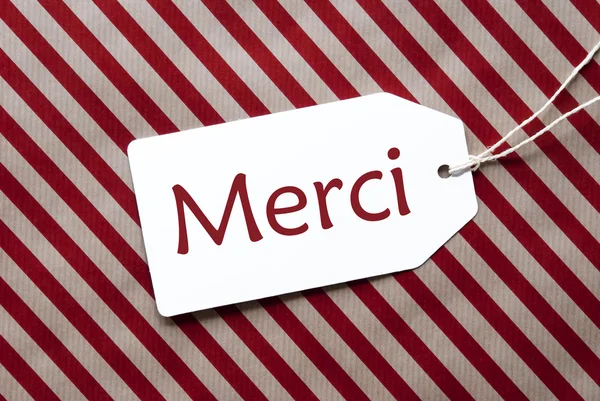 Label On Red Wrapping Paper, Merci Means Thank You — Stock Photo, Image