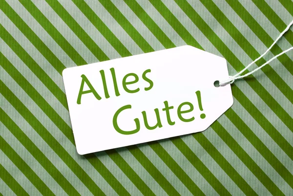 Label op groen inpakpapier, alles gute betekent beste wensen — Stockfoto