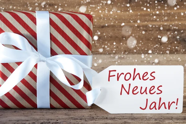 Jelen a hópelyhek, szöveg Neues Jahr azt jelenti, boldog új évet — Stock Fotó