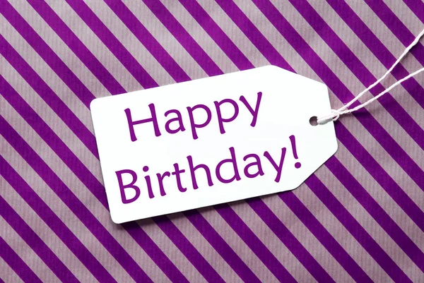 紫色包装纸上的标签，文本生日快乐 — 图库照片