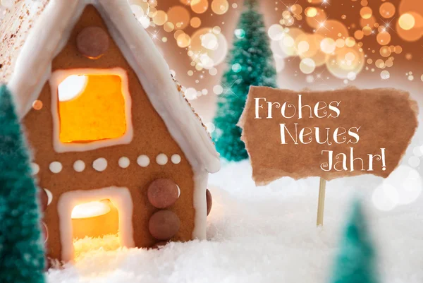 Пряничный домик, бронзовый фон, Neues Jahr означает Новый год — стоковое фото