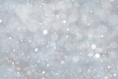 Bokeh ve mavi renk, kar taneleri ile gümüş Noel arka plan