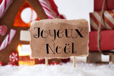 Gingerbread House ile kızak, Joyeux Noel mutlu Noeller anlamına gelir.