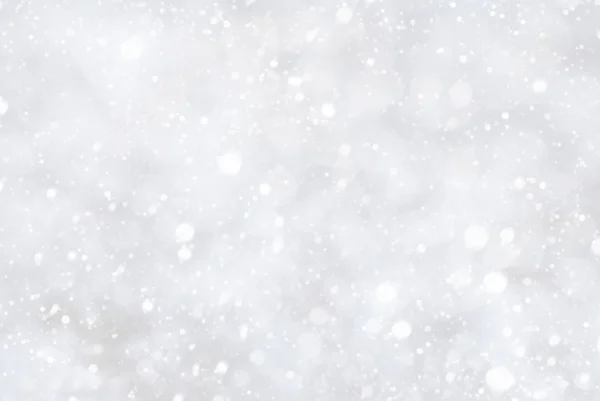 Fondo blanco de Navidad con Bokeh y copos de nieve — Foto de Stock