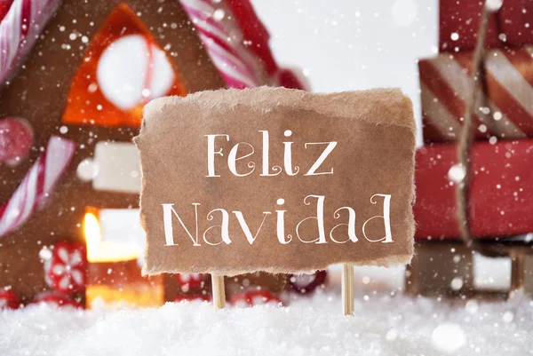 Casa di pan di zenzero con slitta, fiocchi di neve, Feliz Navidad significa Buon Natale — Foto Stock