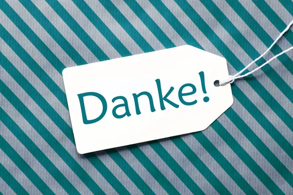 Etiqueta em papel de embrulho turquesa, Danke significa obrigado — Fotografia de Stock