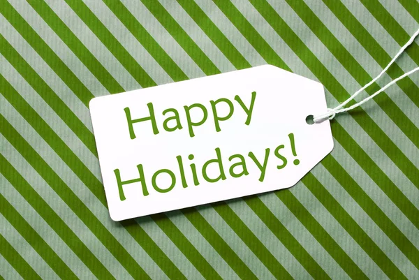 Etikett auf grünem Geschenkpapier, Text Frohe Feiertage — Stockfoto