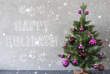 Kar taneleri, çimento duvar, metin Happy Holidays ile Noel ağacı