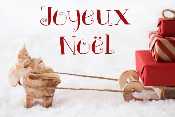 Ren med släde på snö, Joyeux Noel betyder god jul — Stockfoto