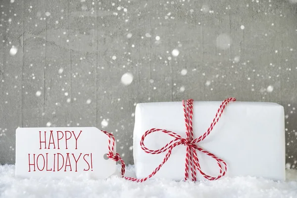 Presente, fundo de cimento com flocos de neve, texto feliz feriados — Fotografia de Stock