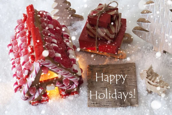 Casa de jengibre, trineo, copos de nieve, texto Felices fiestas —  Fotos de Stock