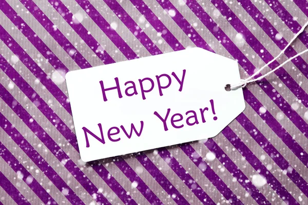 Etichetta su carta viola, Fiocchi di neve, Testo felice anno nuovo — Foto Stock