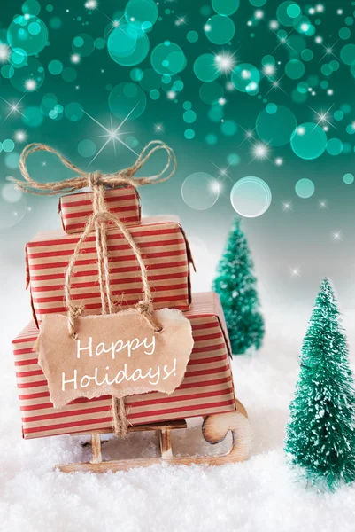 Verticale kerst slee op groene achtergrond, tekst Happy Holidays — Stockfoto