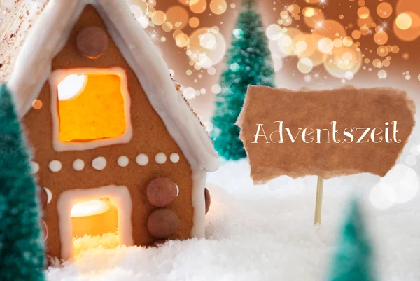 Lebkuchenhaus, Bronzehintergrund, Adventszeit bedeutet Advent — Stockfoto