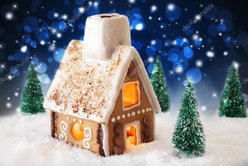 Gingerbread House On Snow And Bokeh Effect