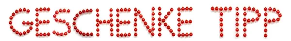Röd julkula prydnad byggnad Geschenk Tipp innebär presenttips — Stockfoto