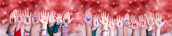 Children Hands Willkommen Means Welcome, Red Christmas Background — Stock Photo, Image