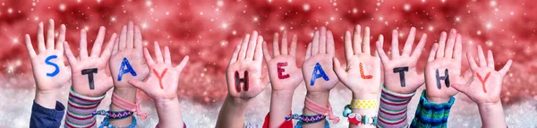 Children Hands Building Word Stay Healthy, Red Christmas Background — Stock Photo, Image