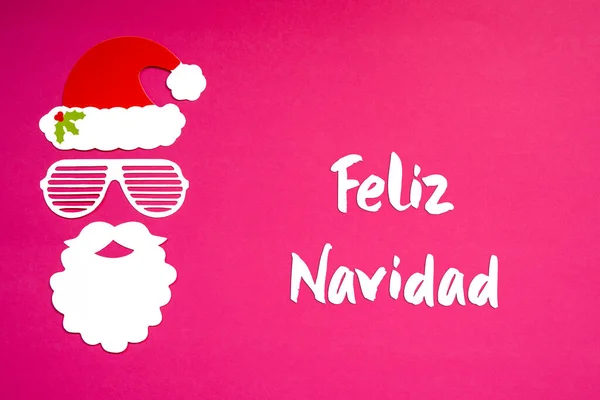 Santa Claus Paper Mask, Pink Background, Feliz Navidad Means Merry Christmas — Stock Photo, Image