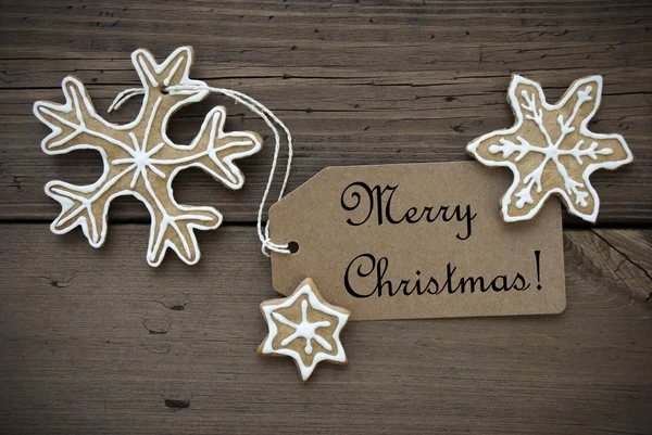 Estrelas de pão de gengibre com etiqueta de Natal feliz — Fotografia de Stock