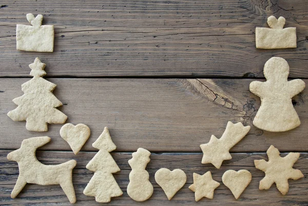 Moldura de cookies em fundo de madeira — Fotografia de Stock