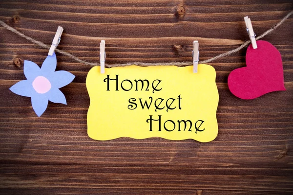 Gelbes Etikett mit Lebenszitat home sweet home — Stockfoto