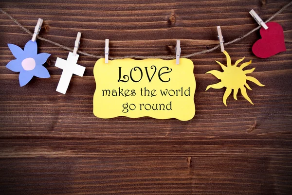 Yellow Label With Life Quote Love Makes the World Go Round — стоковое фото